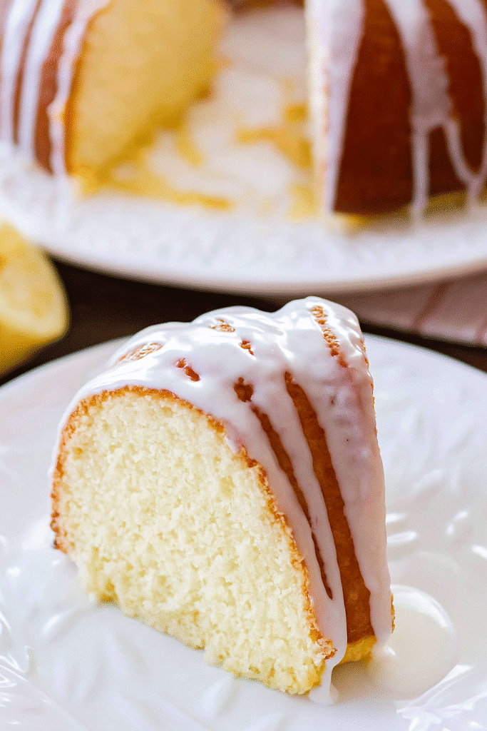 Sliced lemon bundt cake served on a plate