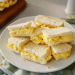 Masters egg salad recipe sandwich quarters on a plate