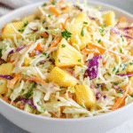 Pineapple coleslaw recipe in a white bowl