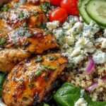 Lemon Herb Grilled Chicken Quinoa Bowl with fresh vegetables and feta cheese