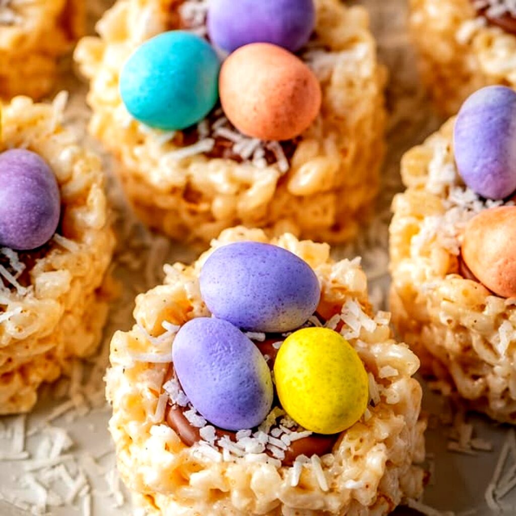 Close-up of Easter Rice Krispie Nests decorated with pastel chocolate eggs