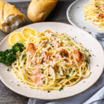 Salmon pasta with lemon cream sauce served with flaky salmon and parsley
