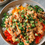 Healthy Bang Bang Ground Turkey Rice Bowl topped with sesame seeds and green onions