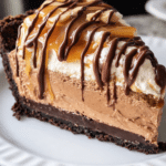 Chocolate peanut butter caramel mousse pie with rich ganache topping and cookie crust