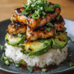 Fresh Honey Lime Chicken served over creamy avocado rice with cilantro and lime wedges.