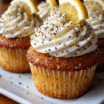 Lemon poppy seed cupcakes with creamy lemon frosting and fresh zest topping