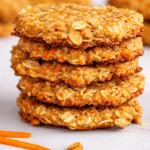 Soft moist 4 ingredient carrot cake cookies stacked on a plate ready to serve